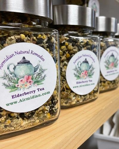 Elderberry Tea in glass jars on a wooden shelf