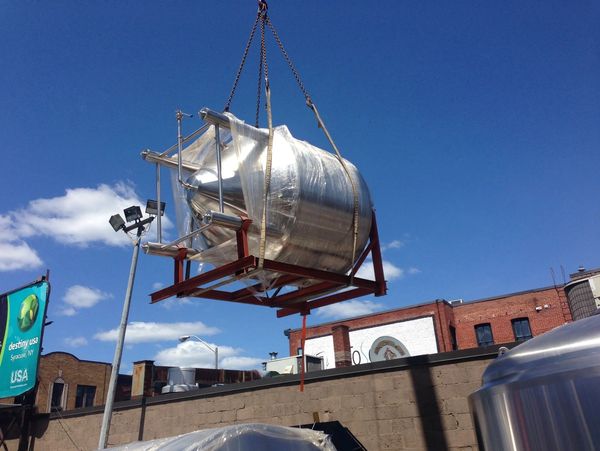 commercial boiler being hoisted 