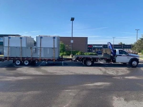 commercial hvac unit being transported