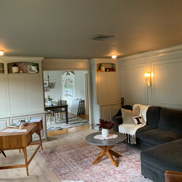 Interior painting of a living room.