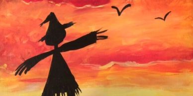 Silhouette of a scarecrow against an orange sunset sky with birds.
