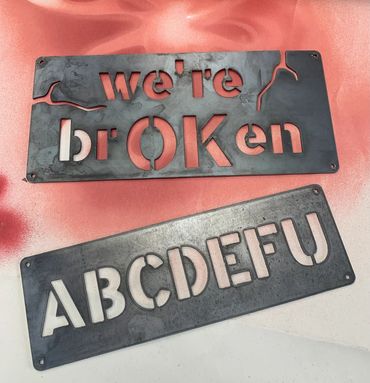 We’re brOKen and ABCDEFU sign