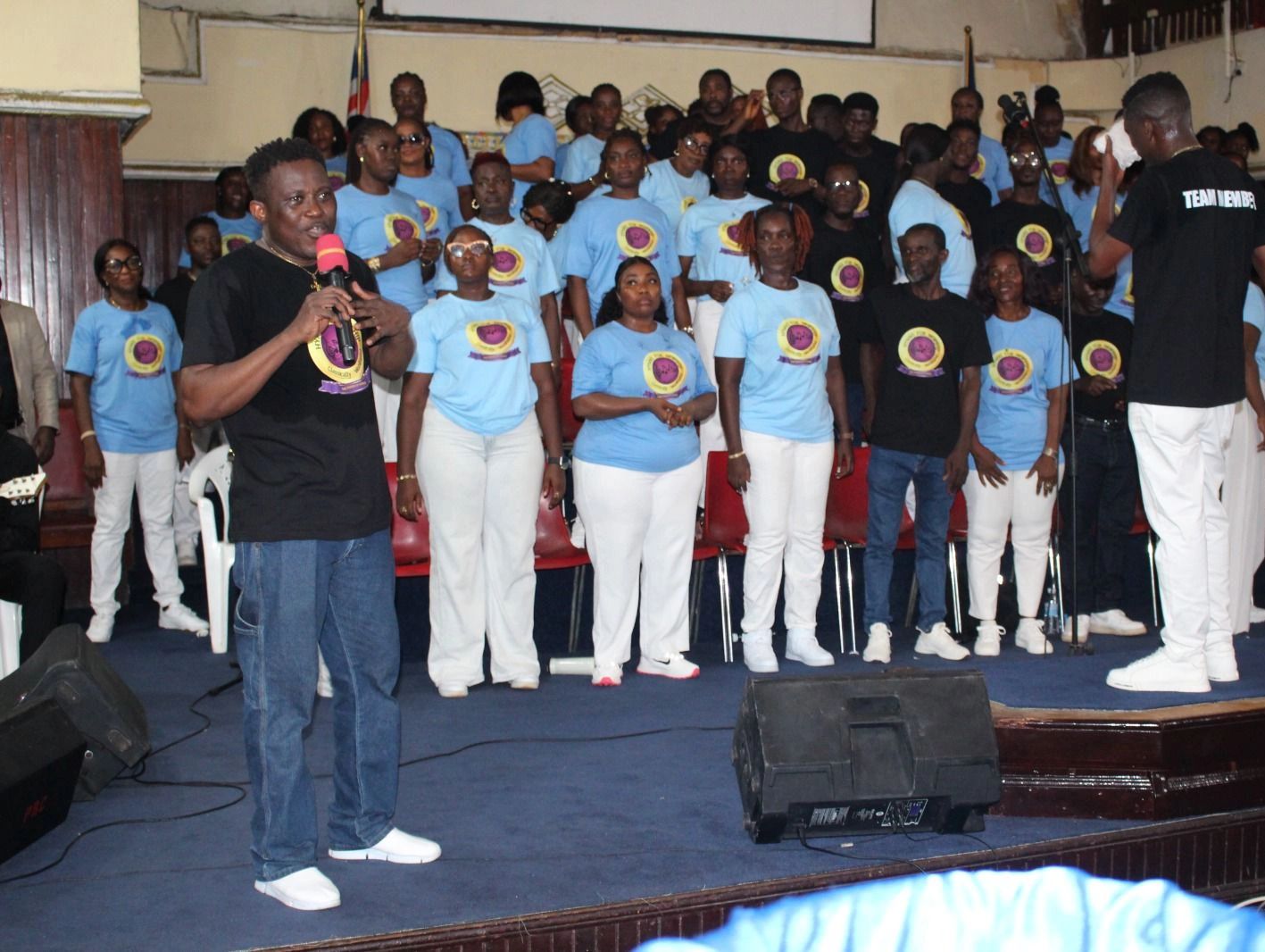 Group event with participants wearing matching shirts.