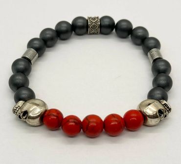 Beaded bracelet with skull and red beads.