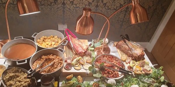 Catering table with assorted food displayed for an event in Liverpool by 5 Star Film Catering.