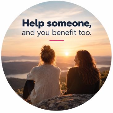 Two people enjoy a sunset with motivational text.