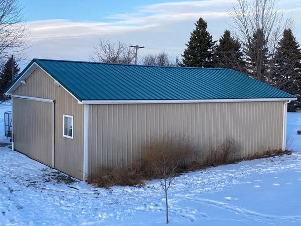 Pole barn with a new Metal Roof.