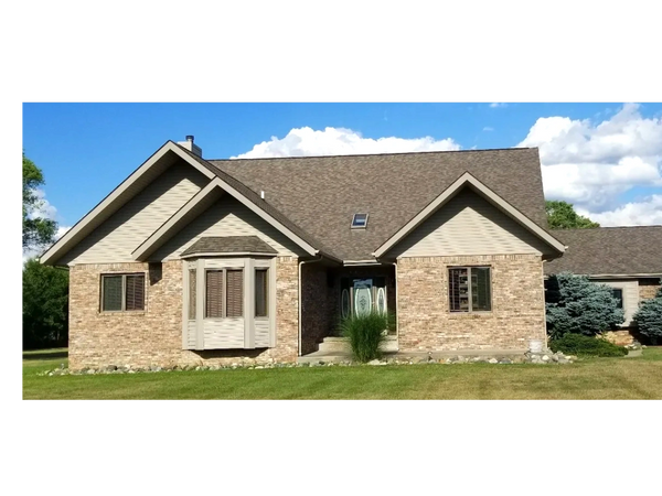 Nice home with old shingle roof.