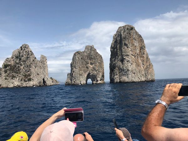 Photo from a trip to Capri, including the ocean views, tourist, and islands.