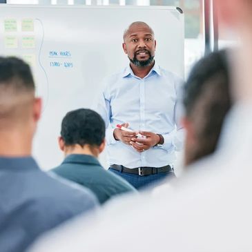 Man giving a presentation in a meeting room.