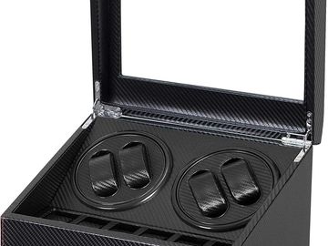 Black carbon fiber watch winder box with transparent lid and two rotating pads.