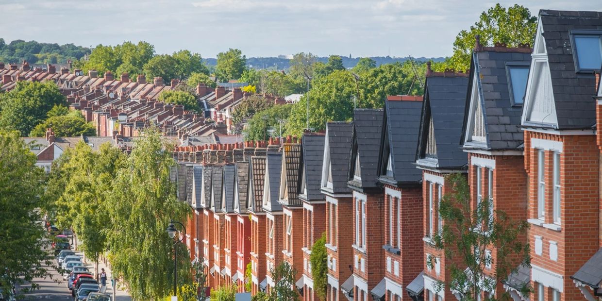 Row of English terraced houses on hilly area 