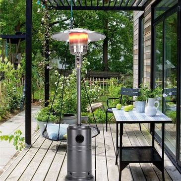 Outdoor patio heater glowing warmly on a wooden deck.