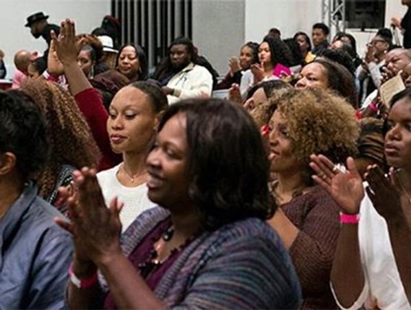 A large group of people at a parenting workshop