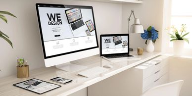 Modern workspace with digital devices showcasing web design.