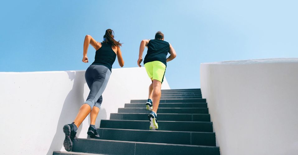 A man and a woman taking steps together