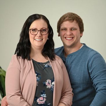 Smiling couple posing for a photo.