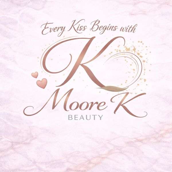 Elegant logo for Moore K Beauty with stylish text and heart accents.
