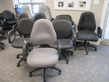 A group of office chairs arranged in a room.