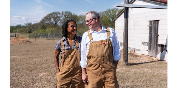 Sean Beard and our dog Starrunner in front of the Texas Colorado river at Lone Oak Farm.