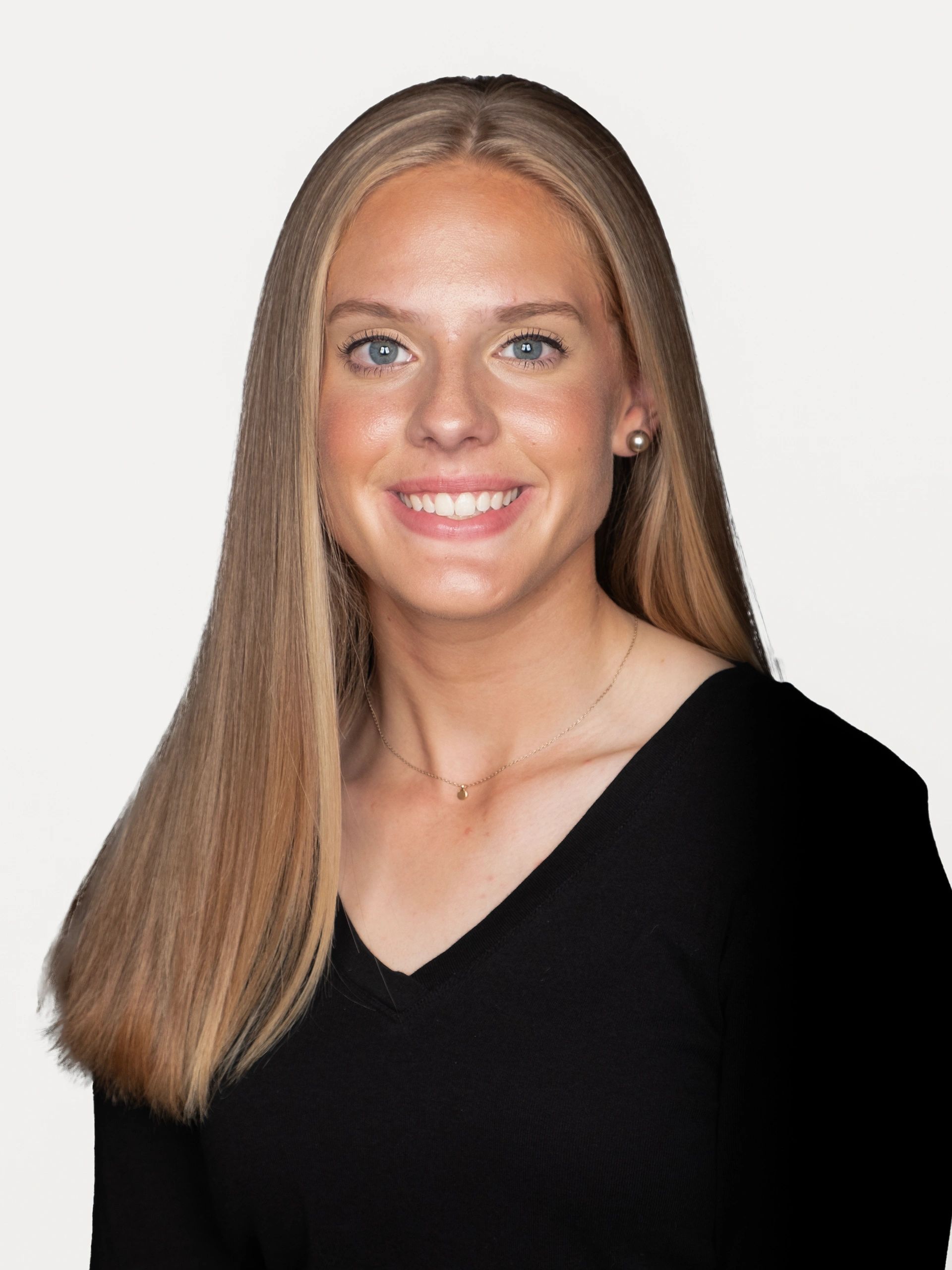 Portrait of a smiling young woman with long blonde hair.