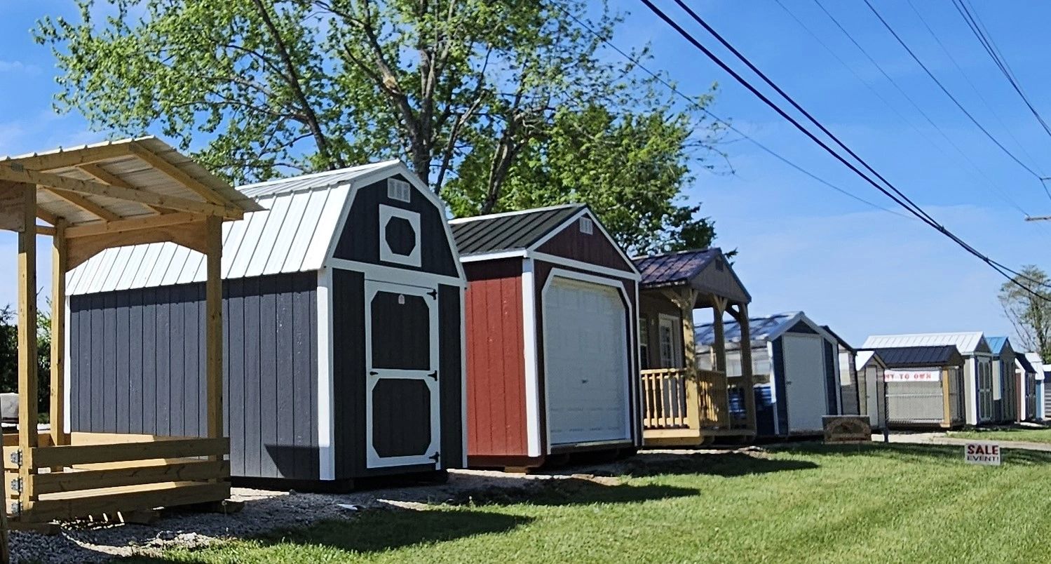 Group of portable storage buildings. Hay feeder, lofted barn, garage, cabin, greenhouse w/ ada door