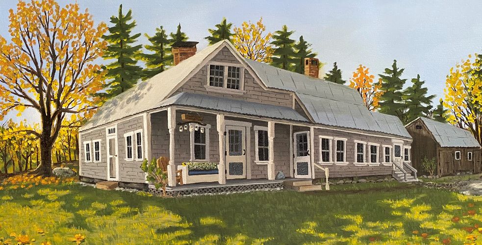 A charming house with autumn trees and a green lawn in a peaceful setting.