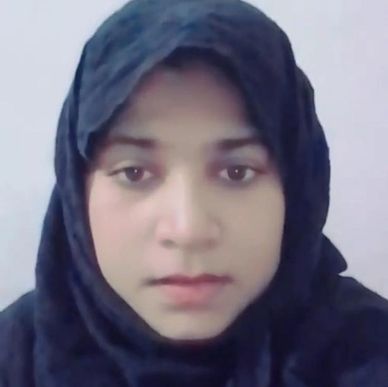 Portrait of a woman wearing a black hijab against a plain background.