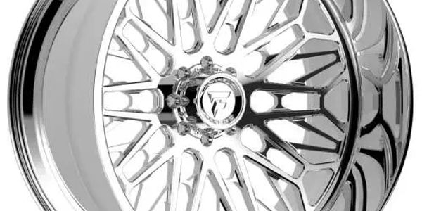 Shiny chrome car wheel rim with intricate design.