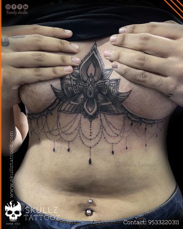 Ornamental Sternum (underboob) tattoo inked at skullz tattooz hyderabad