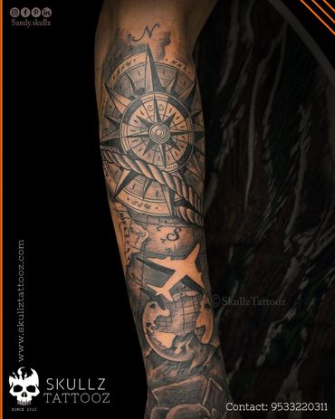 Custom designed travel themed tattoo inked at skullz tattooz hyderabad
