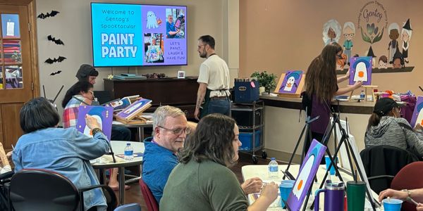Family caregivers and their loved ones with dementia join together fun a fun afternoon of painting 
