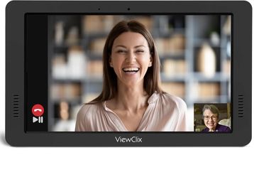 Tablet screen showing a video call with two smiling women.