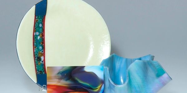 Abstract ceramic plates with colorful designs.