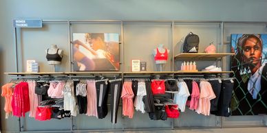Women's athletic training apparel displayed neatly in a store.
