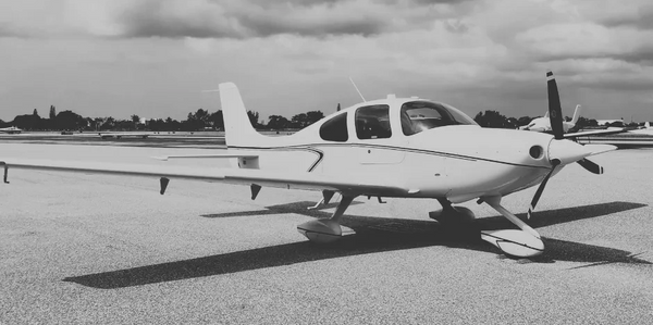 Cirrus Aircraft parked on the ramp at an airport