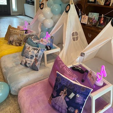 Cozy indoor tents with plush cushions and fun decorations for a kids' party.