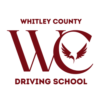 Whitley County Driving School logo with bold maroon letters and a winged emblem.