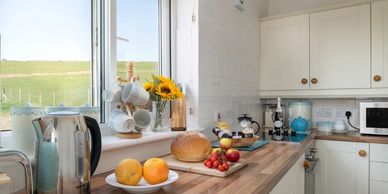 A view of the kitchen at Arallt Holiday Cottage, self catering property on the Llŷn Peninsula.

