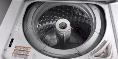 Top-loading washing machine drum.