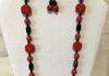 Ceramic oriental style red beads with black onyx beads. Comes with earrings. Item #18-10-5. Price $20.00