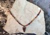 Wood beads and earth stones with authentic arrowhead. Length 27 in. Item #19-1-12. Price $20.00