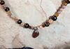 close up of tiger's eye pendant.