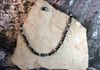 Black and clear crackle glass beads with earrings. Length 23.5 - 24.5 adjustable. Item #18-10-9. Price $20.00