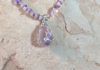 close up of rose quartz pendant with Swarovski crystal