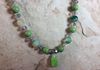 Close up of green stone hanger