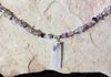 close up of amethyst and quartz crystal hanger