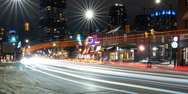 Long exposure of traffic lights on a city street at night.