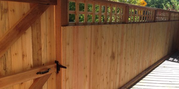 a wooden compound wall with door