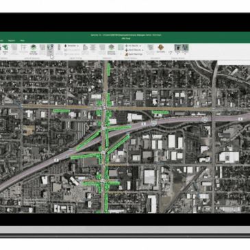 Aerial map view showing road intersections with green-highlighted traffic routes.
